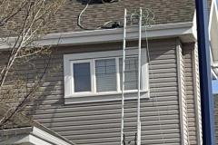Bulldozer-roofer-repairing-a-roof-in-Edmonton